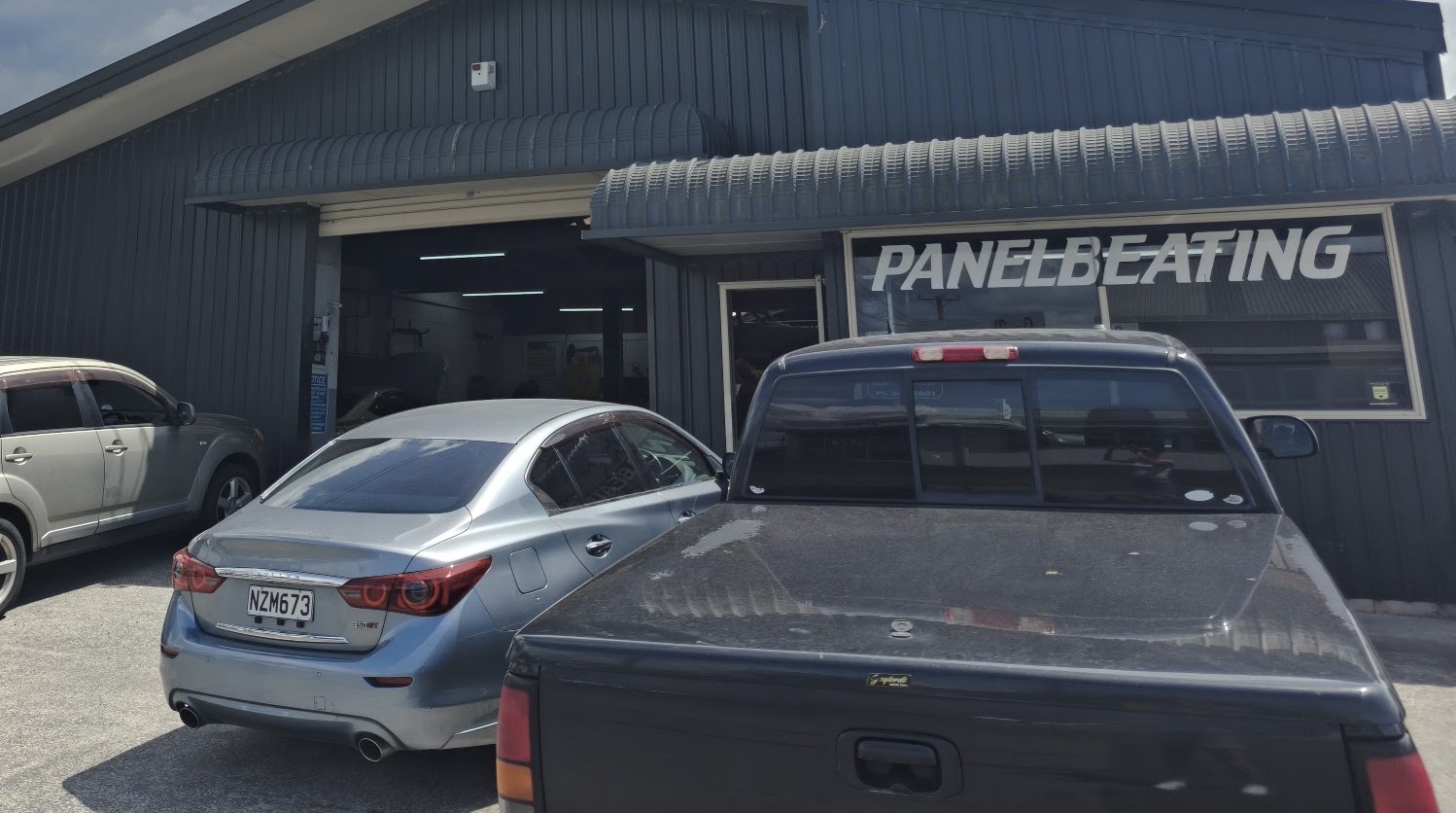 Rob's Panel & Paint workshop, panelbeating bay with the roller door open